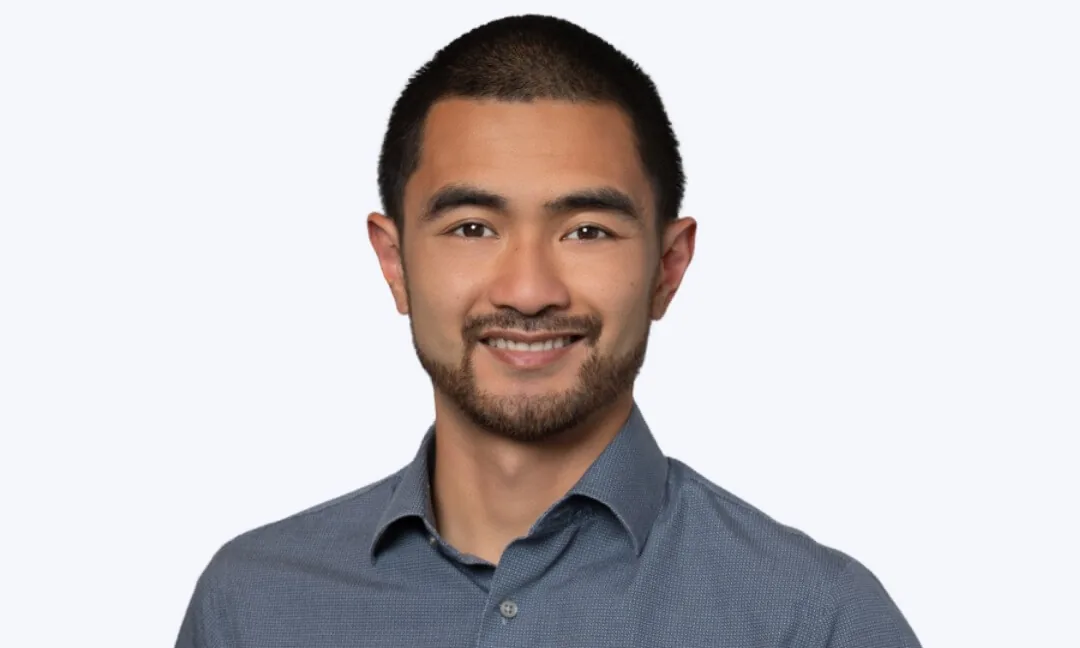 Ian Cruz, CPA, in a gray button-down shirt.